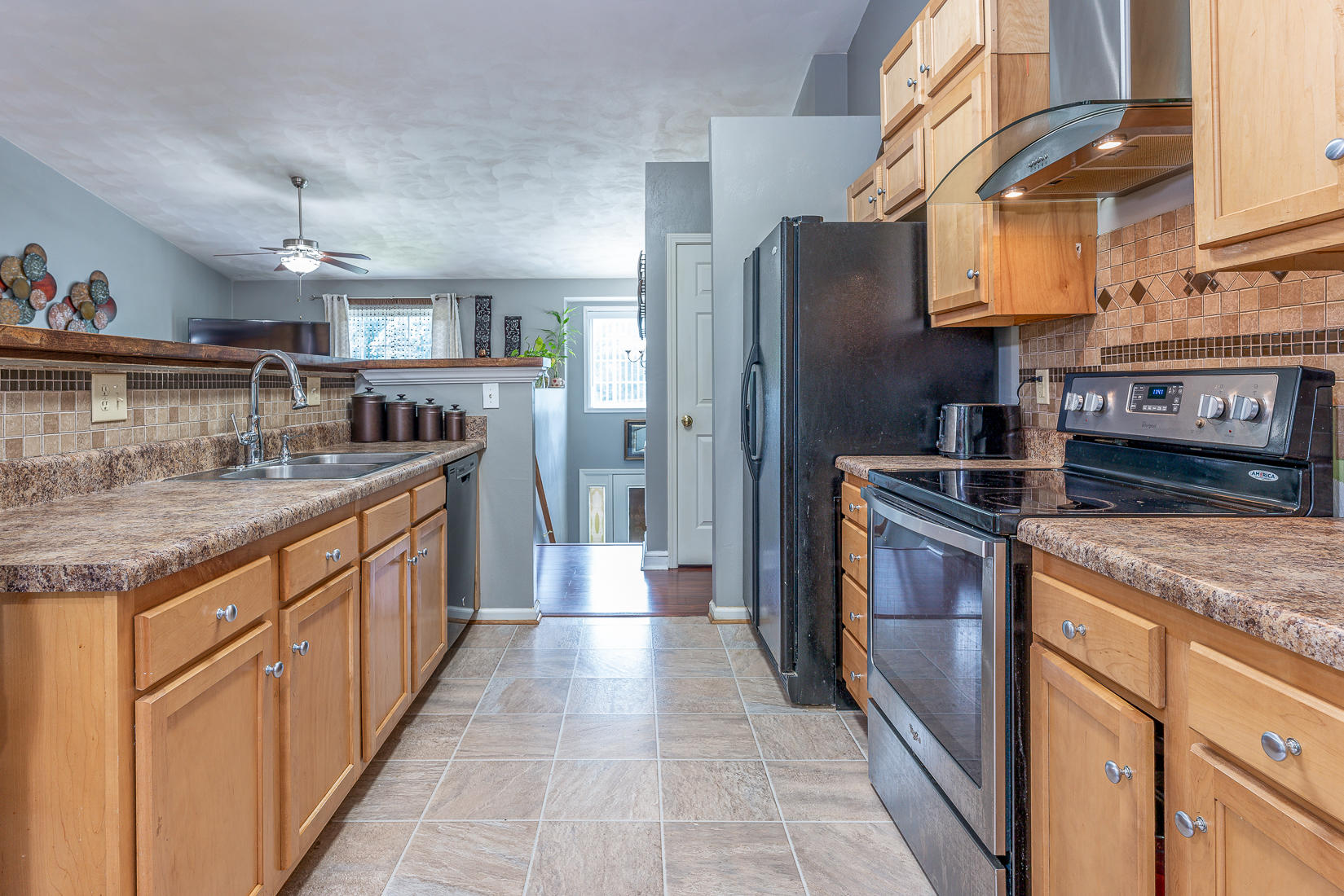 4245 Daugherty Road Salem, VA 24153 - Photo 14 of 44 a kitchen with stainless steel appliances granite countertop a refrigerator a stove and a sink