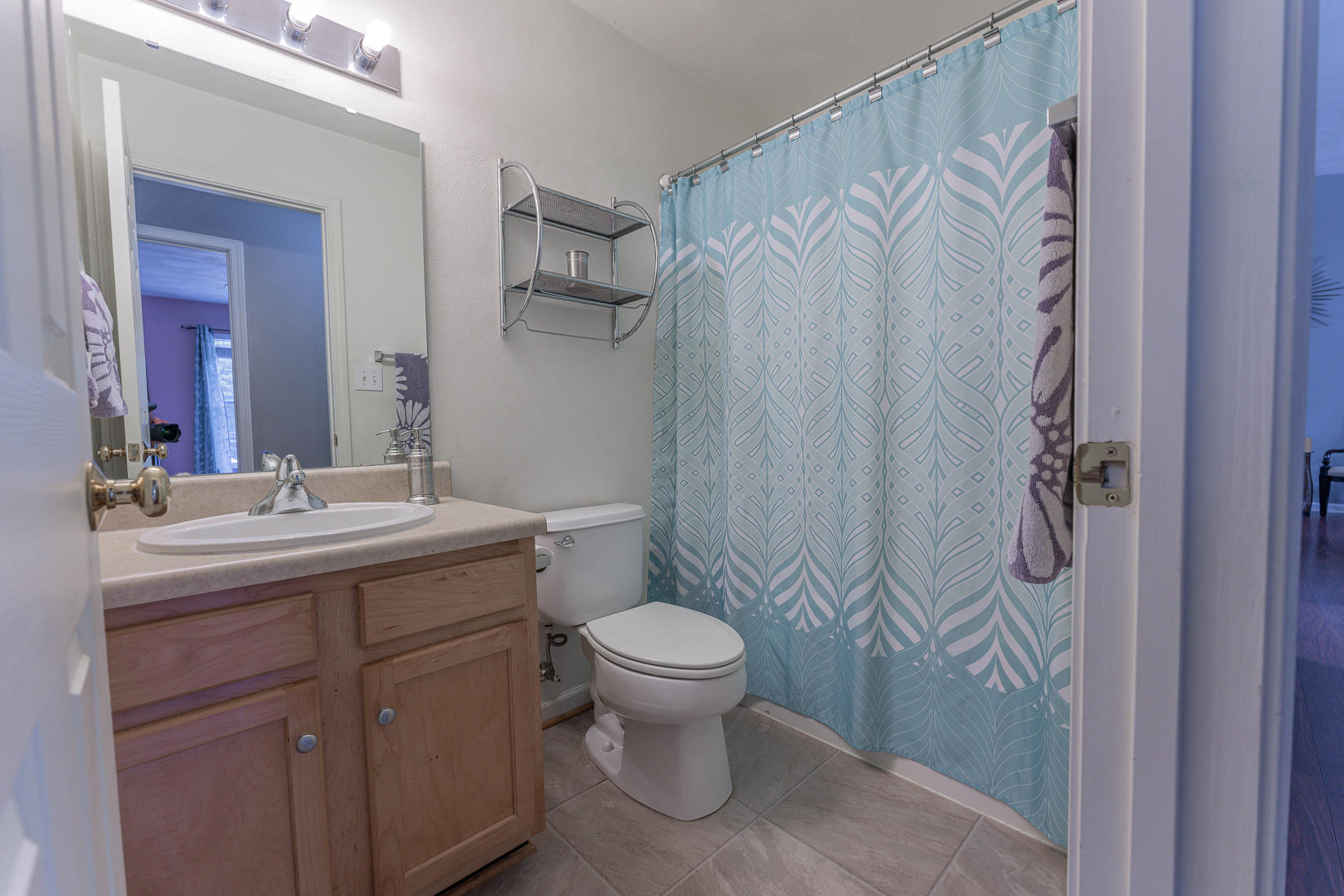 4245 Daugherty Road Salem, VA 24153 - Photo 17 of 44 a bathroom with a granite countertop sink toilet and a mirror