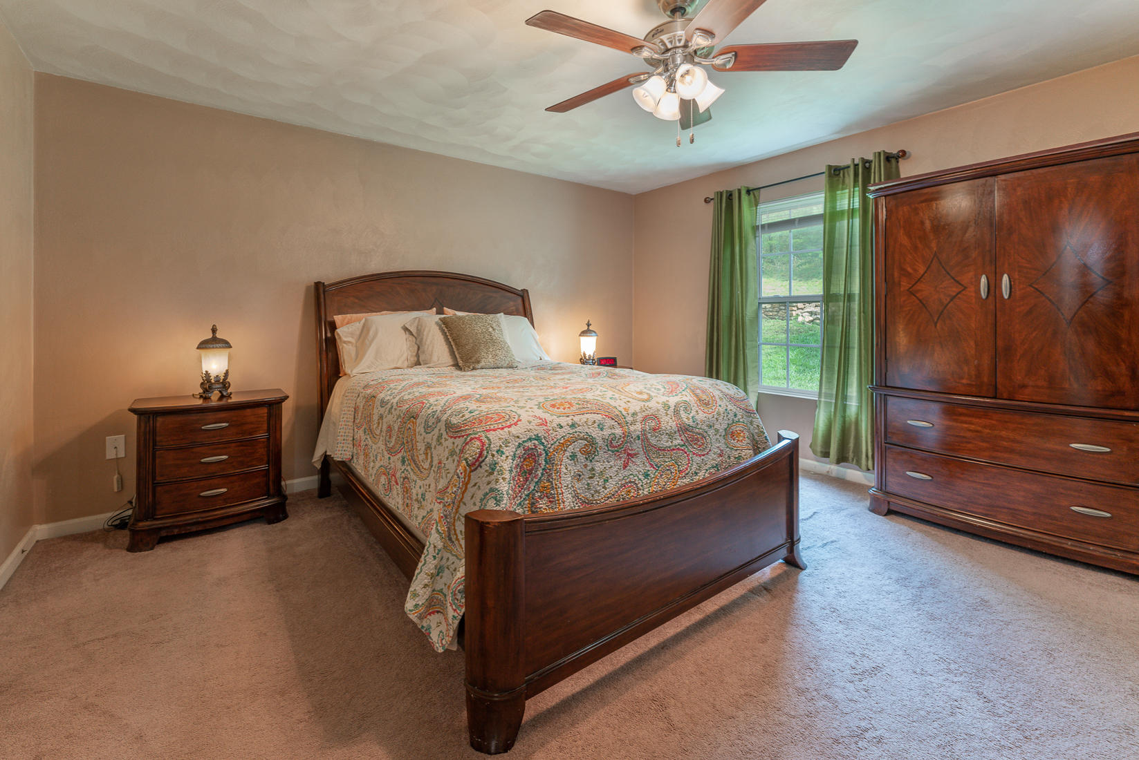 4245 Daugherty Road Salem, VA 24153 - Photo 22 of 44 a bedroom with a bed and a chandelier