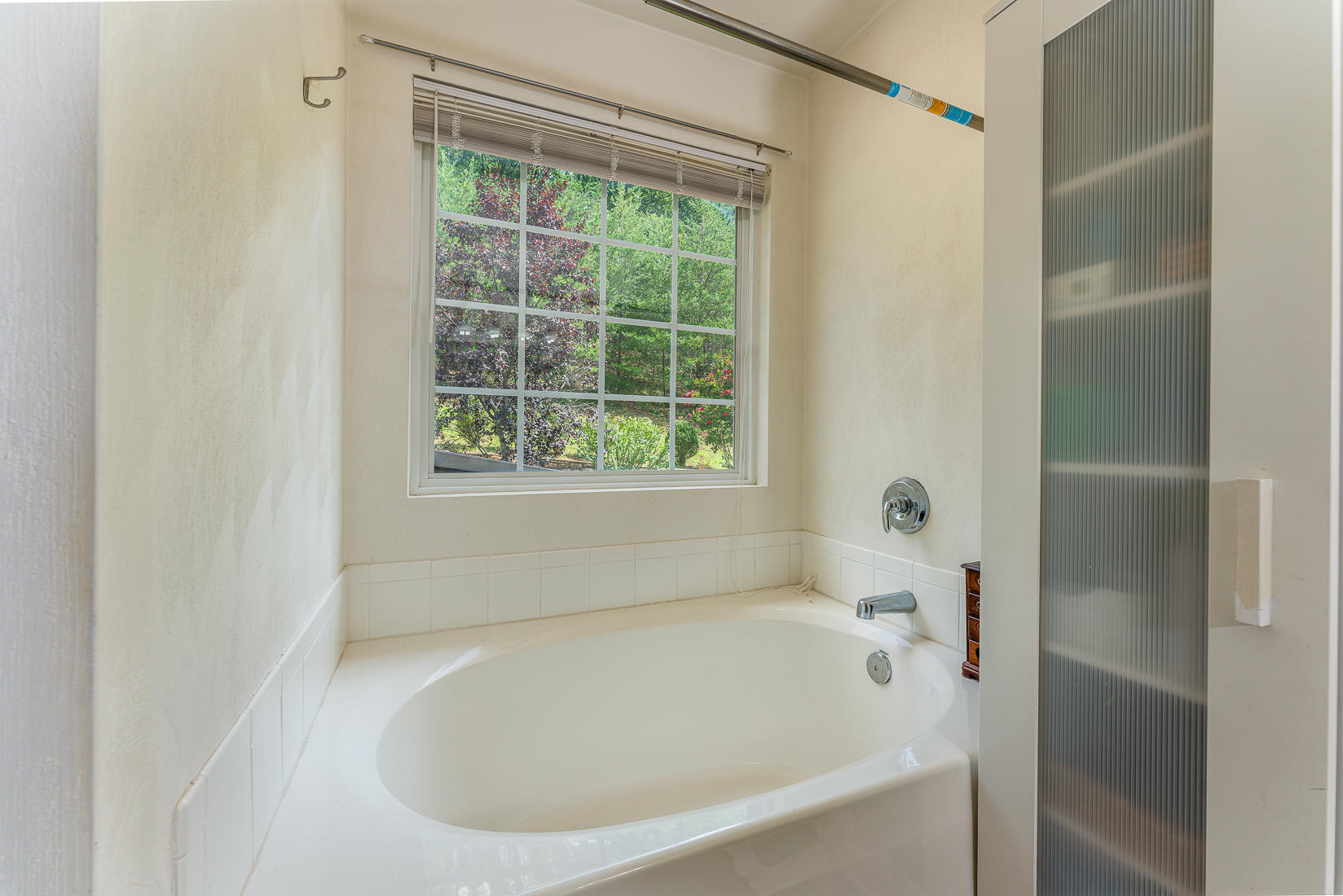 4245 Daugherty Road Salem, VA 24153 - Photo 25 of 44 a white bath tub sitting next to a window