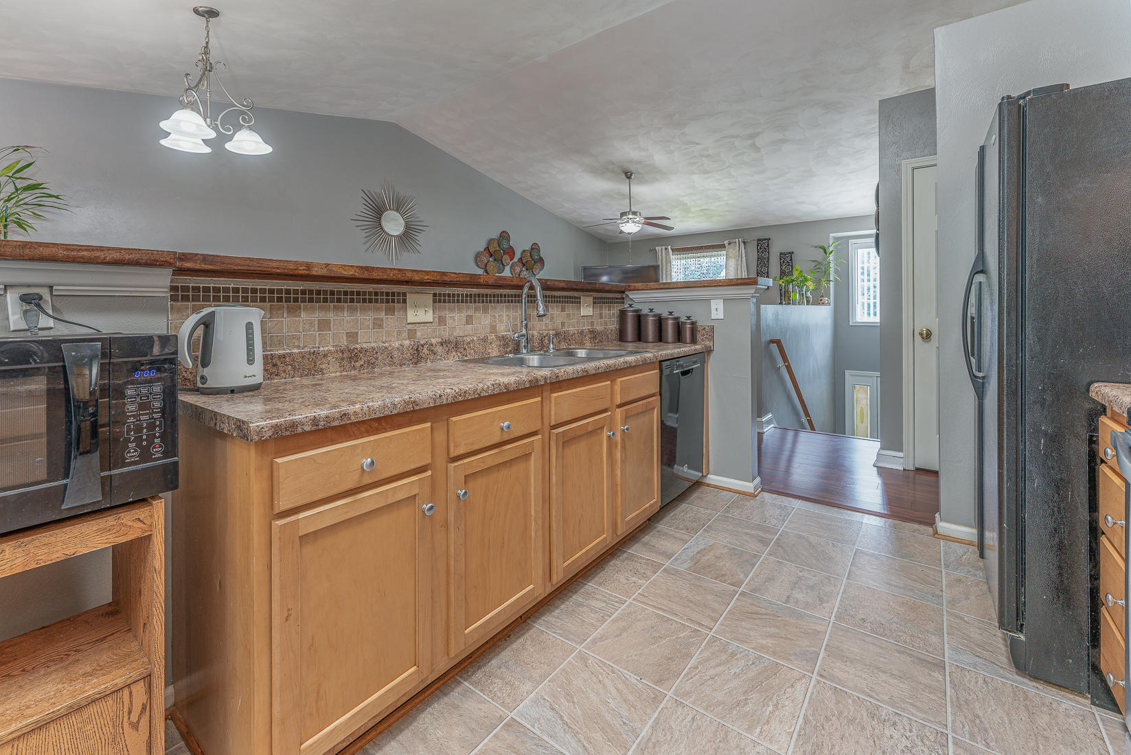 4245 Daugherty Road Salem, VA 24153 - Photo 8 of 44 a kitchen with stainless steel appliances granite countertop a sink and a refrigerator