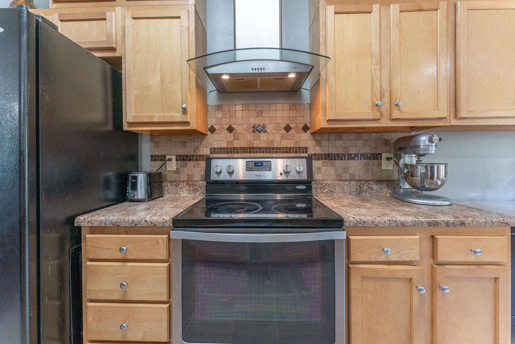 4245 Daugherty Road Salem, VA 24153 - Photo 9 of 44 a kitchen with granite countertop white cabinets and a stove