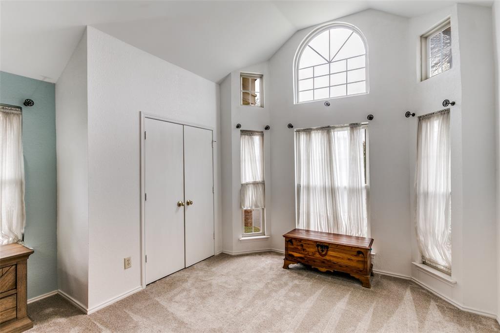 3438 Spring Willow Drive Grapevine, TX 76051 - Photo 13 of 27 an empty room with windows and wooden walls