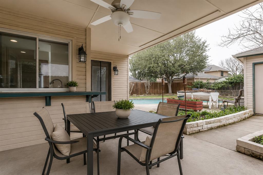 3438 Spring Willow Drive Grapevine, TX 76051 - Photo 17 of 23 Virtual staging.Covered patio featuring a ceiling fan, a pass-through window, and exterior wall sconces