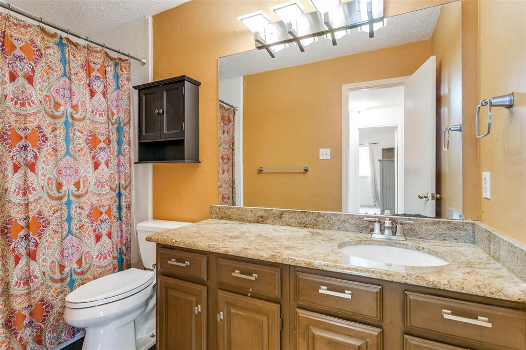 3438 Spring Willow Drive Grapevine, TX 76051 - Photo 20 of 27 a bathroom with a granite countertop sink and a mirror