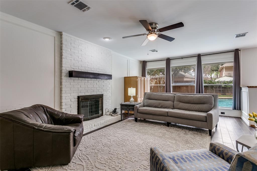 3438 Spring Willow Drive Grapevine, TX 76051 - Photo 4 of 27 a living room with furniture and a fireplace
