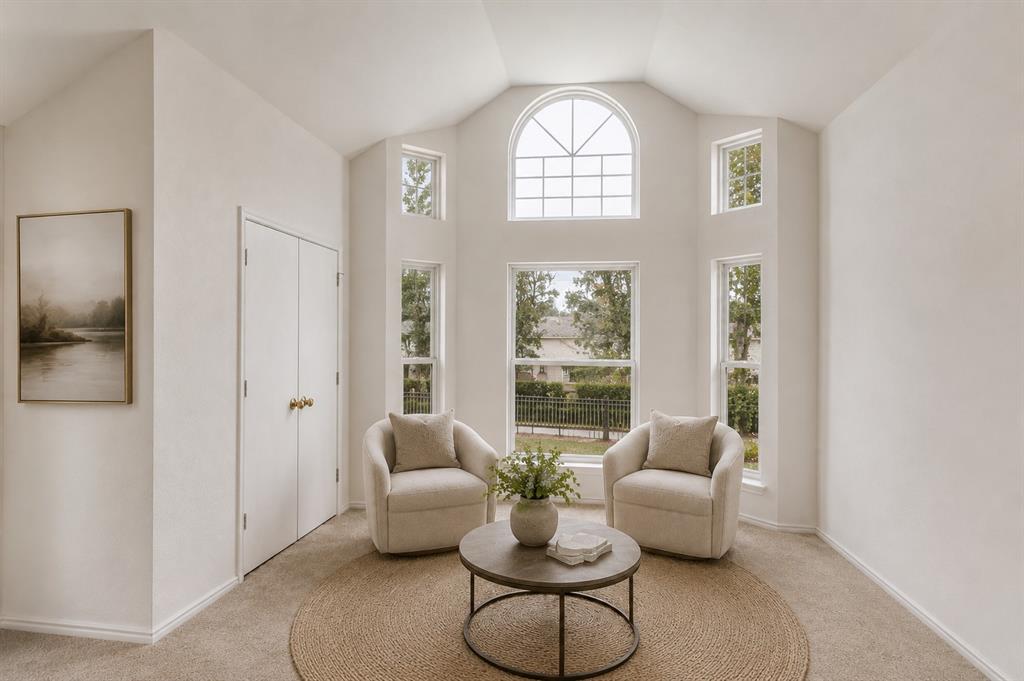 3438 Spring Willow Drive Grapevine, TX 76051 - Photo 9 of 23 Virtually Staged. Window-lined room featuring a vaulted ceiling and an arched transom window
