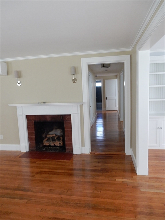 2 Littleton Road, Unit 1 Harvard, MA 01451 - Photo 4 of 24 a view of a livingroom with a fireplace and window