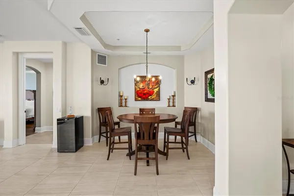 a spacious bathroom with double sink and a mirror