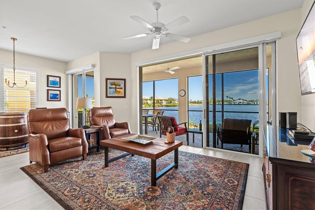 1135 Riverscape Street, Unit 1135 Bradenton, FL 34208 - Photo 23 of 100 a living room with furniture rug and window