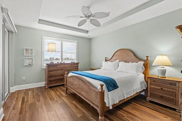 a living room with a table chairs and a large window