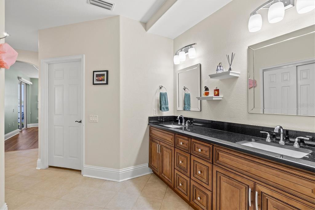1135 Riverscape Street, Unit 1135 Bradenton, FL 34208 - Photo 32 of 100 a spacious bathroom with double sink and a mirror