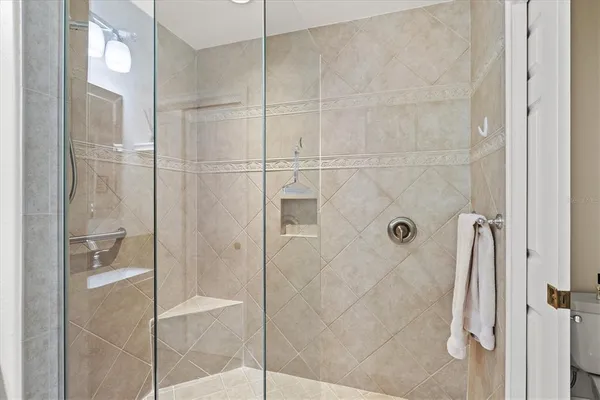 an aerial view of a city with an ocean