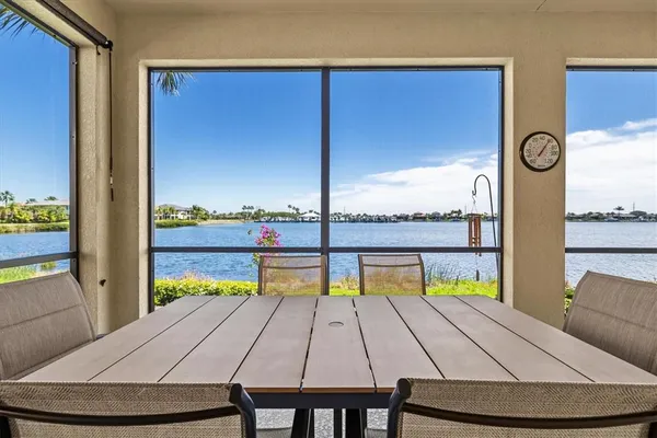 a view of a sign in a garden next to a lake