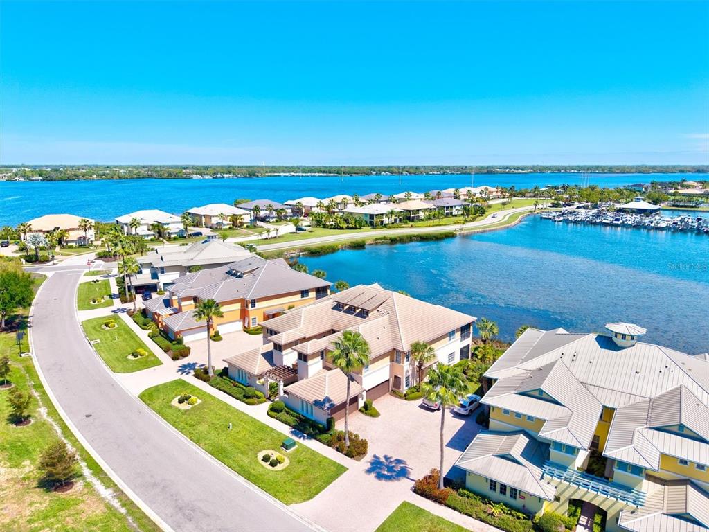 1135 Riverscape Street, Unit 1135 Bradenton, FL 34208 - Photo 58 of 100 an aerial view of a city with an ocean