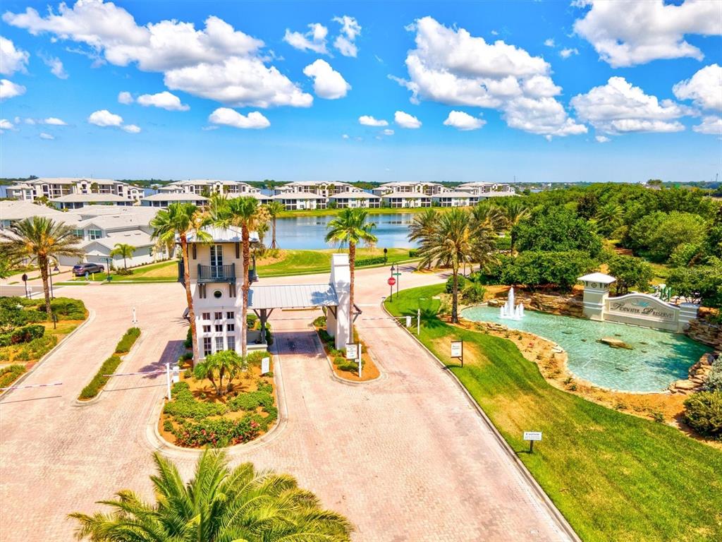 1135 Riverscape Street, Unit 1135 Bradenton, FL 34208 - Photo 65 of 100 a view of a swimming pool with a lawn chairs