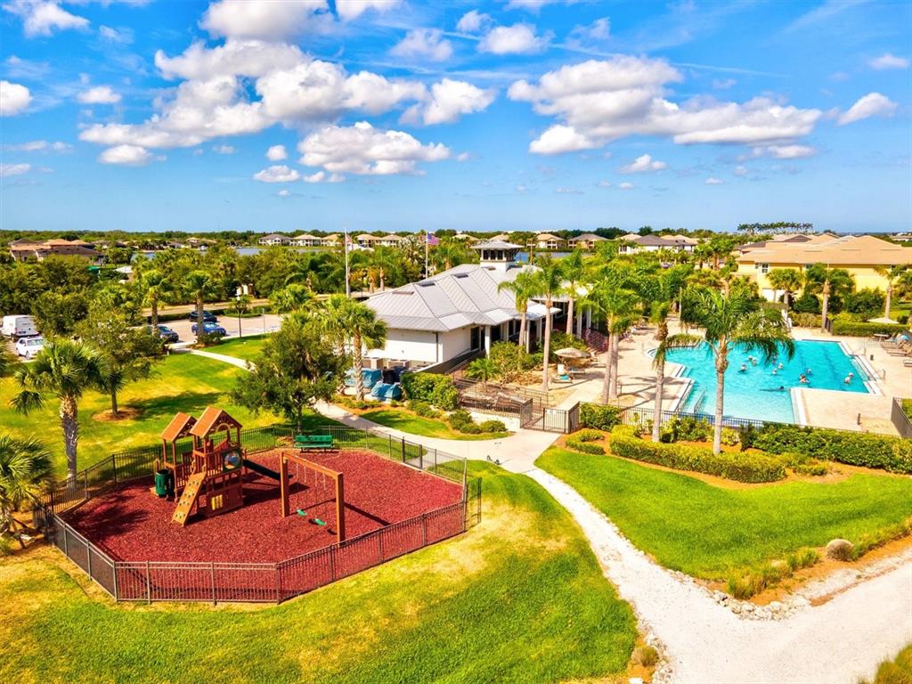 1135 Riverscape Street, Unit 1135 Bradenton, FL 34208 - Photo 74 of 100 a view of a swimming pool with an outdoor seating
