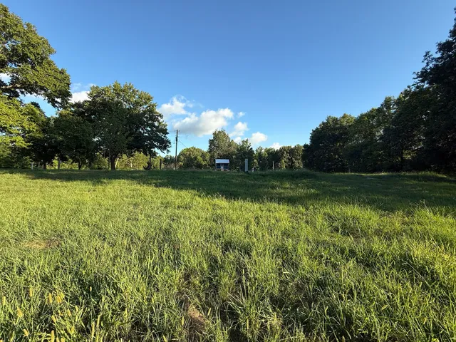 a view of a golf course with a lake