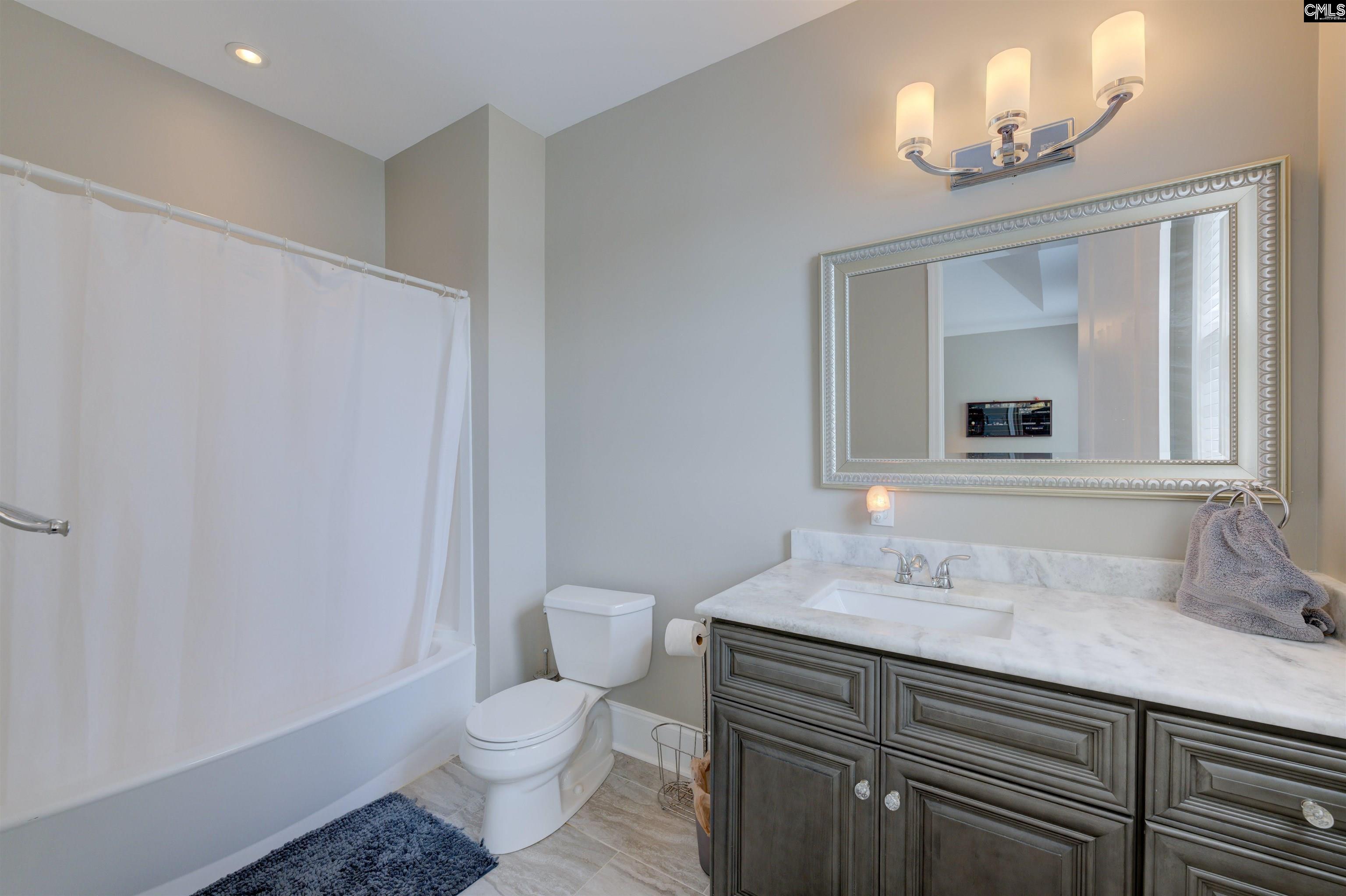 305 Northlake Road Columbia, SC 29223 - Photo 35 of 46 a bathroom with a sink a toilet and a mirror