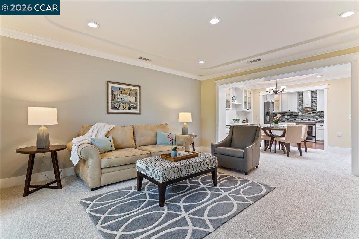 1332 Running Springs Road, Unit 1 Walnut Creek, CA 94595 - Photo 13 of 26 a living room with furniture a lamp and a table