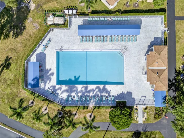 a view of a two chairs and table in a patio