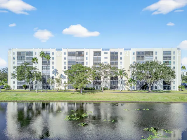 a view of a lake with a building in the background