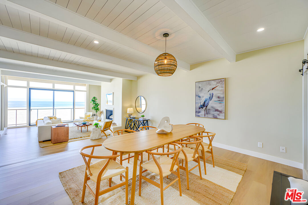 1 Spinnaker Street, Unit 11 Marina del Rey, CA 90292 - Photo 12 of 35 a dining room with wooden floor and large window