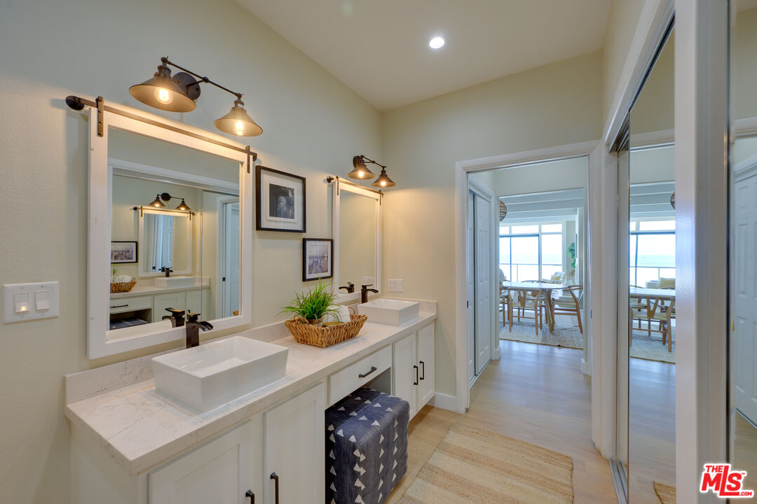 1 Spinnaker Street, Unit 11 Marina del Rey, CA 90292 - Photo 22 of 35 a spacious bathroom with a double vanity sink and mirror