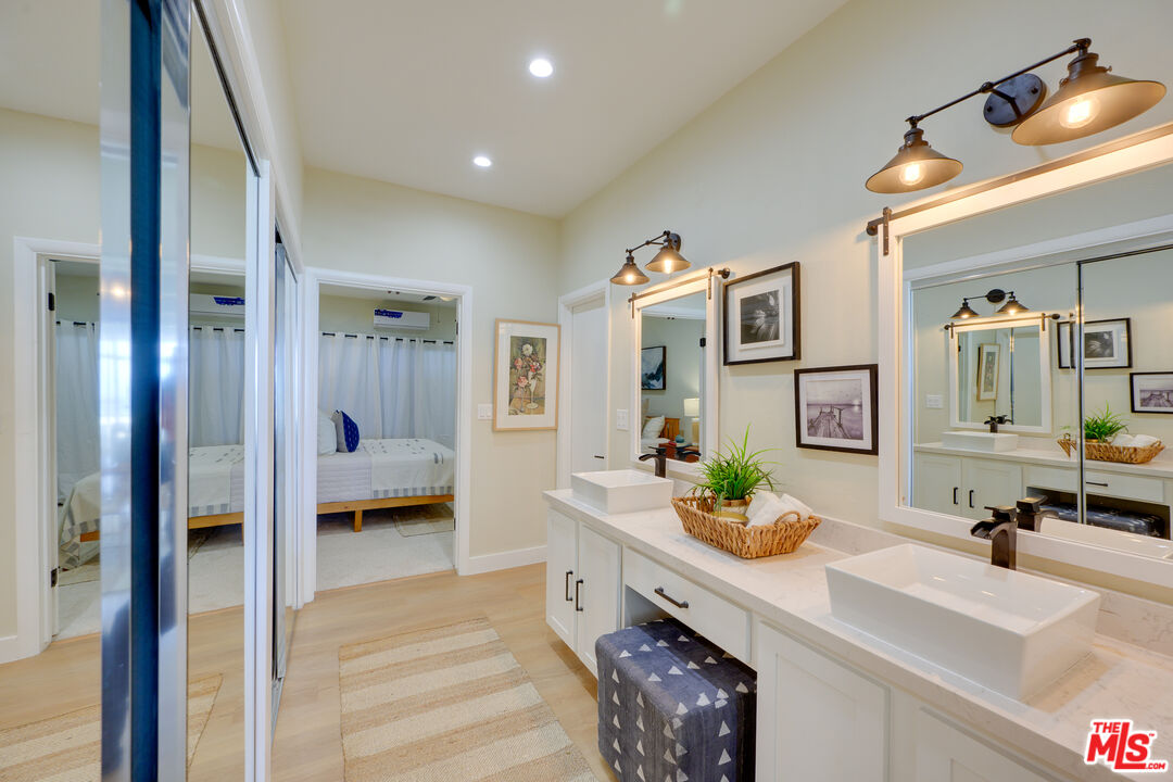 1 Spinnaker Street, Unit 11 Marina del Rey, CA 90292 - Photo 23 of 35 a spacious en suite bathroom with a double vanity sink and a mirror