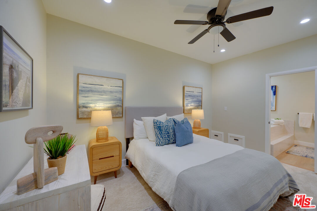 1 Spinnaker Street, Unit 11 Marina del Rey, CA 90292 - Photo 26 of 35 a bedroom with a bed and ceiling fan