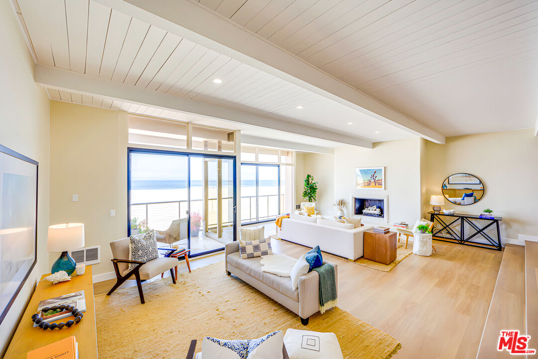 1 Spinnaker Street, Unit 11 Marina del Rey, CA 90292 - Photo 3 of 35 a living room with furniture and a large window