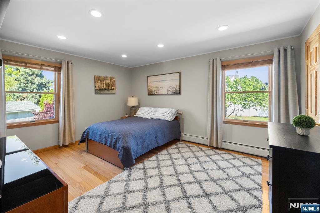 66 Roehrs Drive Wallington, NJ 07057 - Photo 20 of 37 a bedroom with a large bed and a window