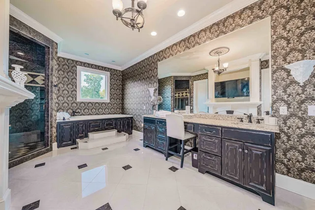 a bathroom with a double vanity sink mirror and bathtub