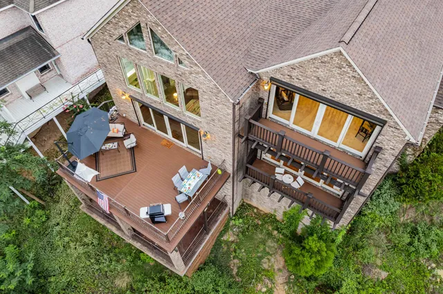 aerial view of a house with roof deck
