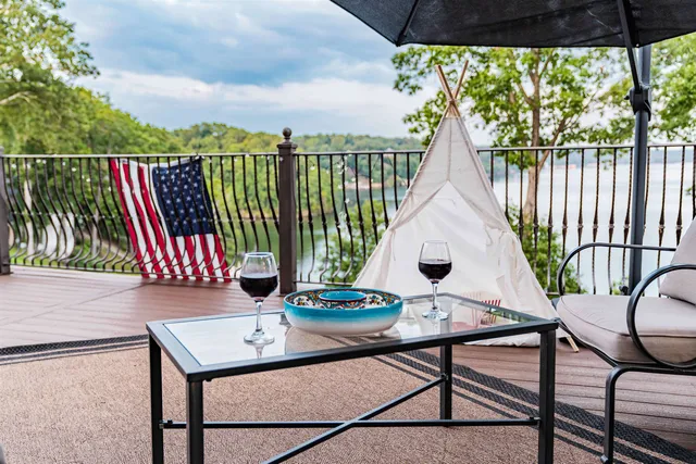 a backyard of a house with table and chairs