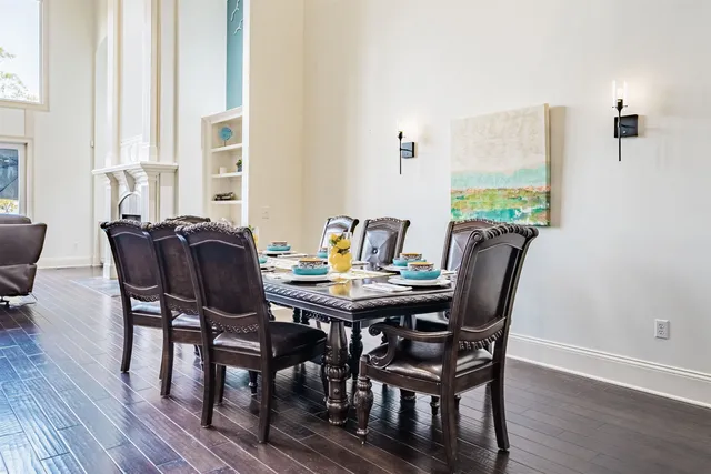 a view of a dining room with furniture and window
