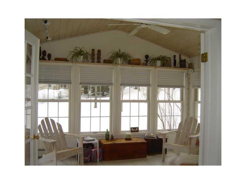 88 Parsons Road Norway, ME 04268 - Photo 13 of 35 Sunroom. The sun room floor has...