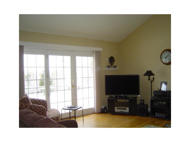88 Parsons Road Norway, ME 04268 - Photo 10 of 35 Living Room. The living room opens...
