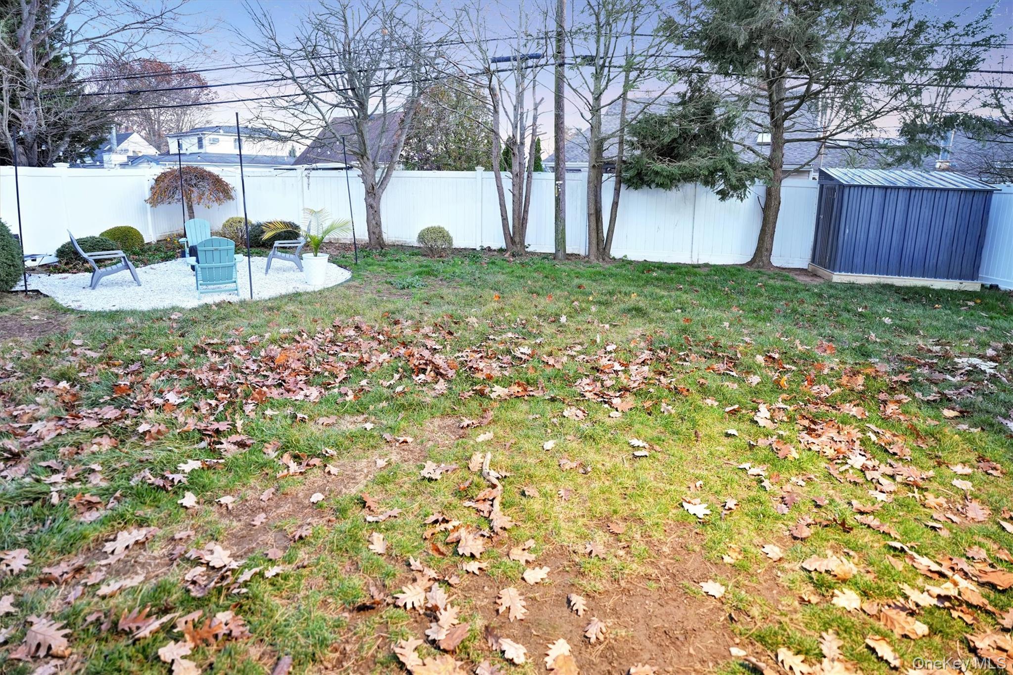 43 Ribbon Lane Wantagh, NY 11793 - Photo 28 of 36 Fenced backyard with a patio area and a storage unit