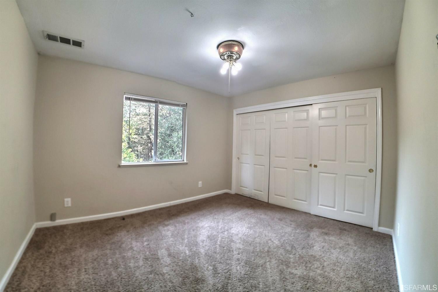 241 Ealey Road Glencoe, CA 95232 - Photo 30 of 43 a view of an empty room with a window