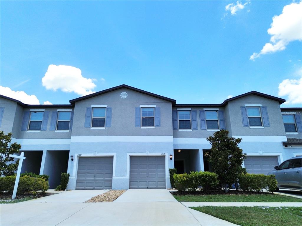 11826 Dumaine Valley Road Riverview, FL 33579 - Photo 2 of 54 a house view with a garden space