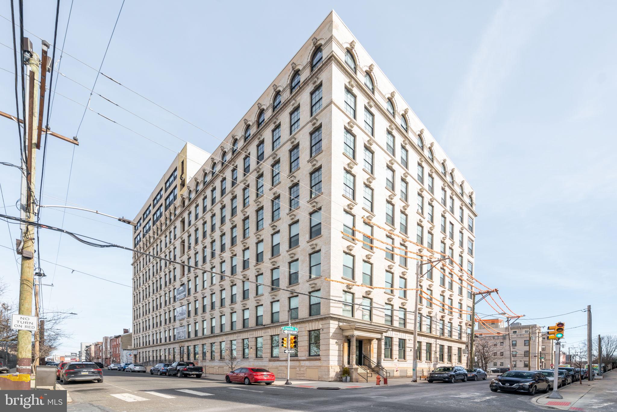 1401-25 North 5th Street, Unit 401 Philadelphia, PA 19122 - Photo 13 of 14 a city view with tall buildings and a street