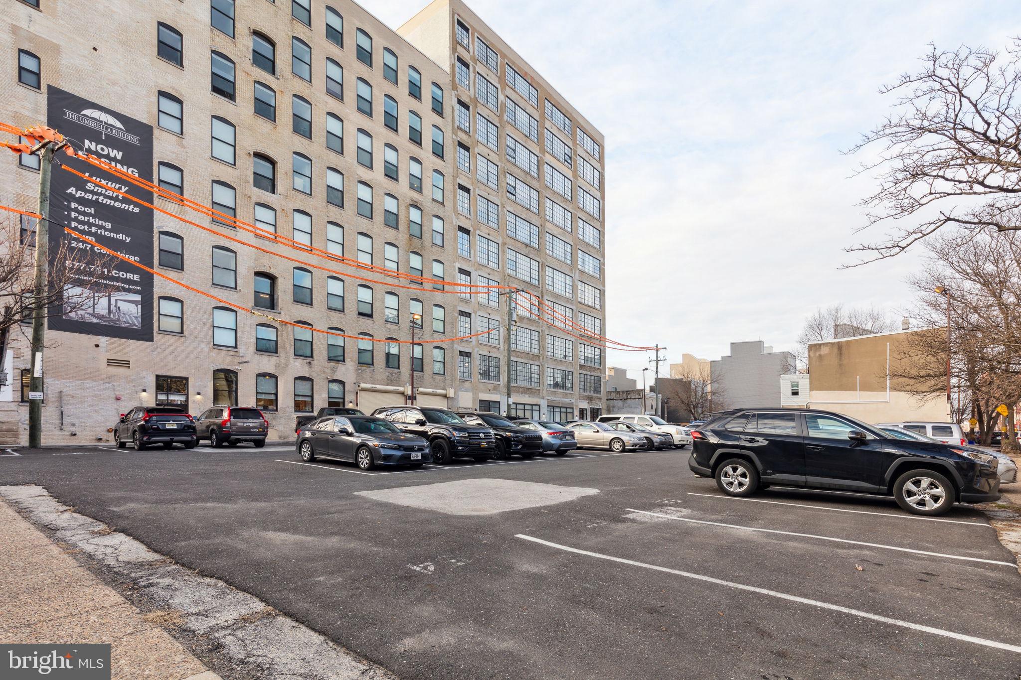 1401-25 North 5th Street, Unit 401 Philadelphia, PA 19122 - Photo 14 of 14 a buildings with car parked in front of it