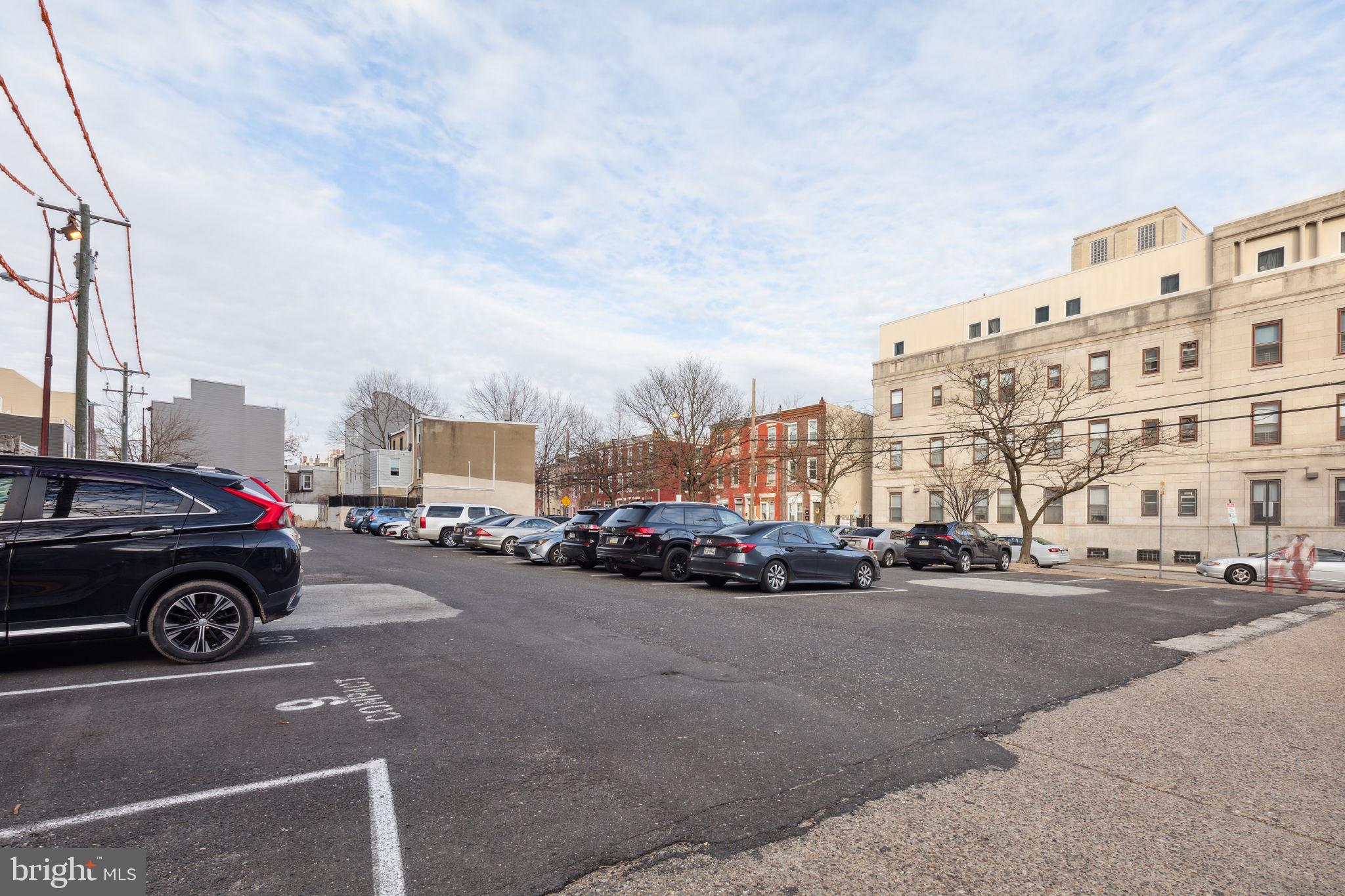 1401-25 North 5th Street, Unit 401 Philadelphia, PA 19122 - Photo 10 of 14 a view of street with cars and a buildings