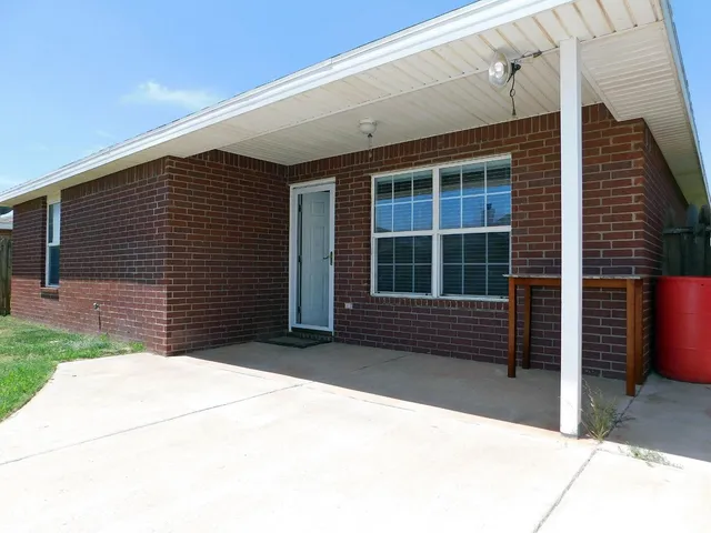 a front view of a house with a large window
