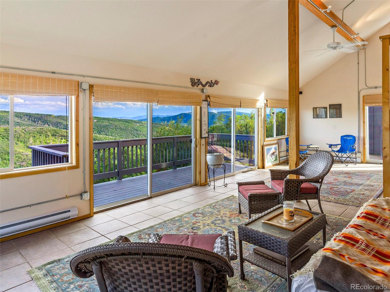 40705 Hill N Dale Road Steamboat Springs, CO 80487 - Photo 17 of 37 a bedroom with furniture and a large window