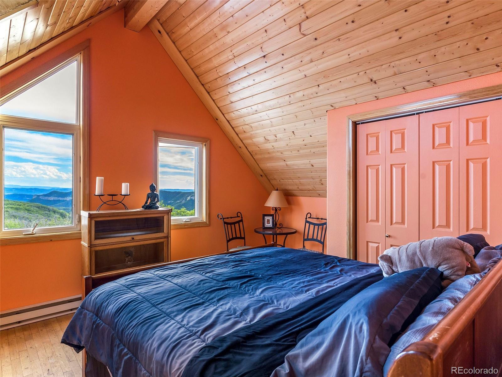 40705 Hill N Dale Road Steamboat Springs, CO 80487 - Photo 26 of 37 a bed room with a bed and a large window
