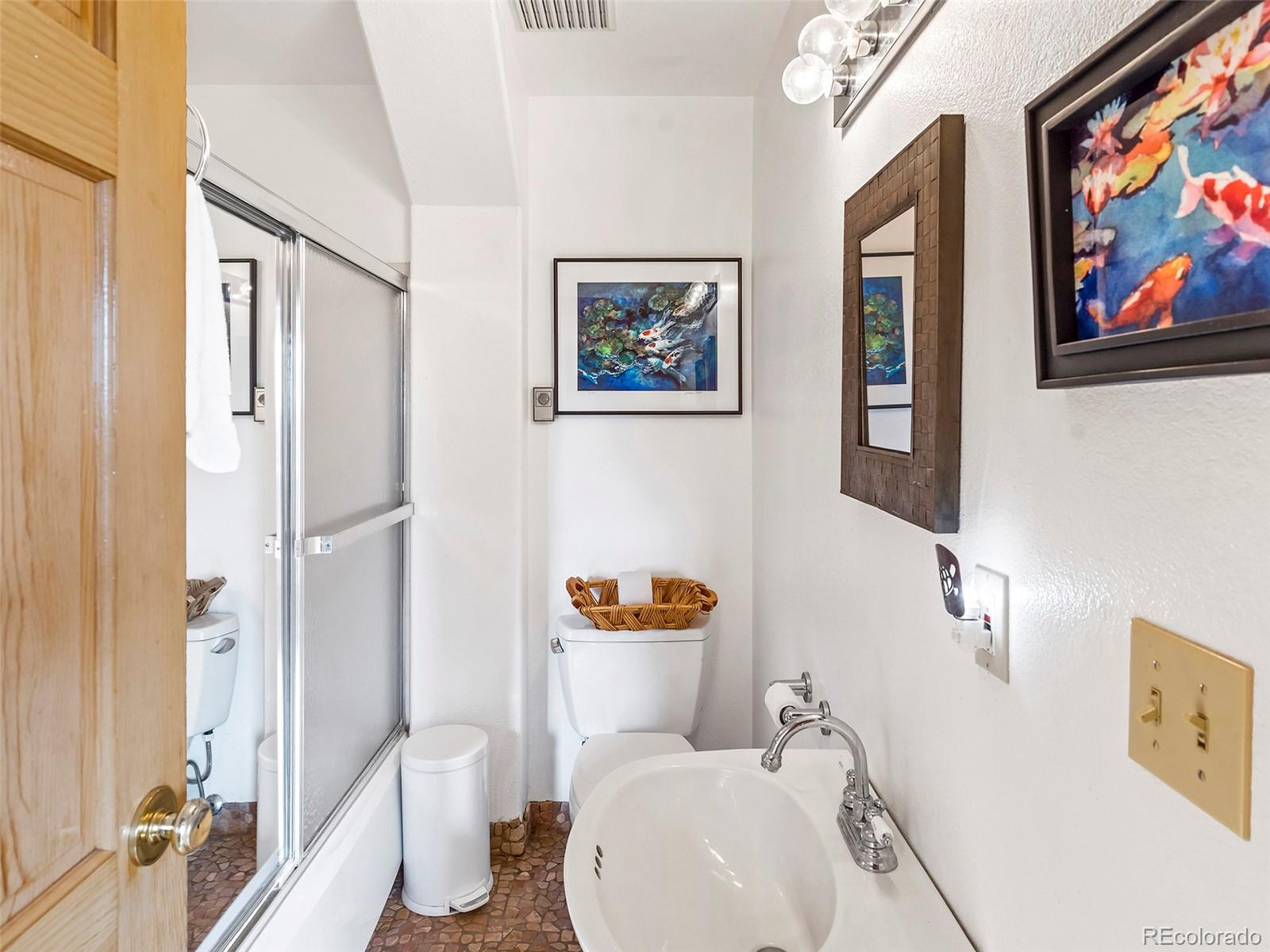 40705 Hill N Dale Road Steamboat Springs, CO 80487 - Photo 29 of 37 a white toilet sitting next to a bathroom