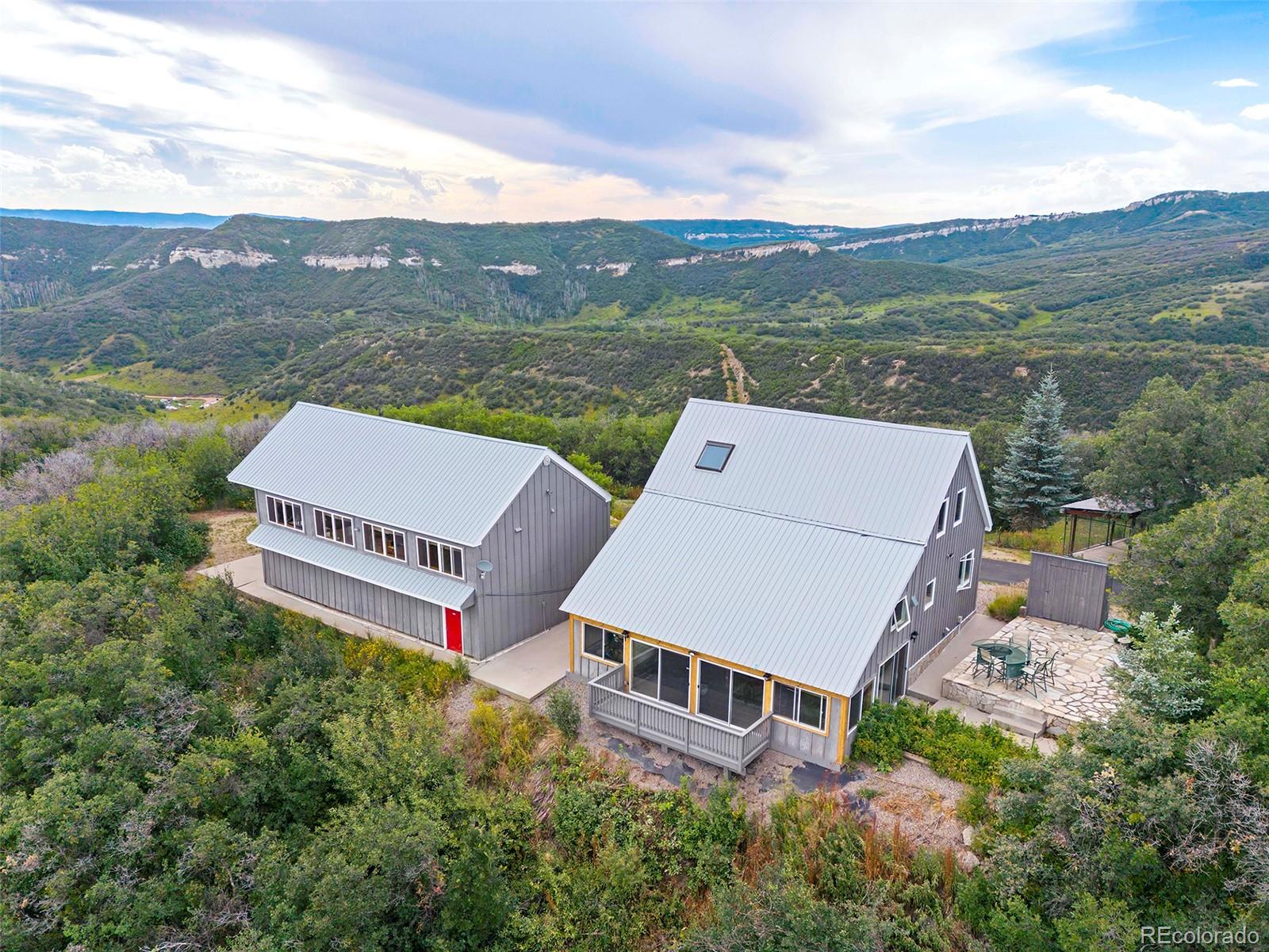 40705 Hill N Dale Road Steamboat Springs, CO 80487 - Photo 3 of 37 an aerial view of a house with mountain view