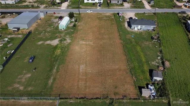 an aerial view of houses with yard